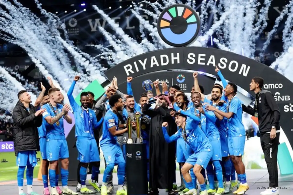 Al-Hilal players celebrating with trophy at Kingdom Arena Riyadh